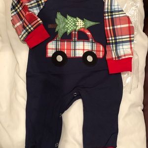 One pc NWT Boutique outfit still in plastic. Open foot.